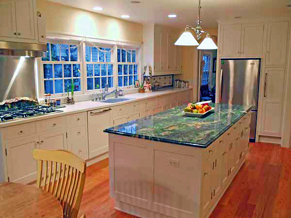 Remodeled kitchen with Van Gough Granite topped island, and white fine cabinets.